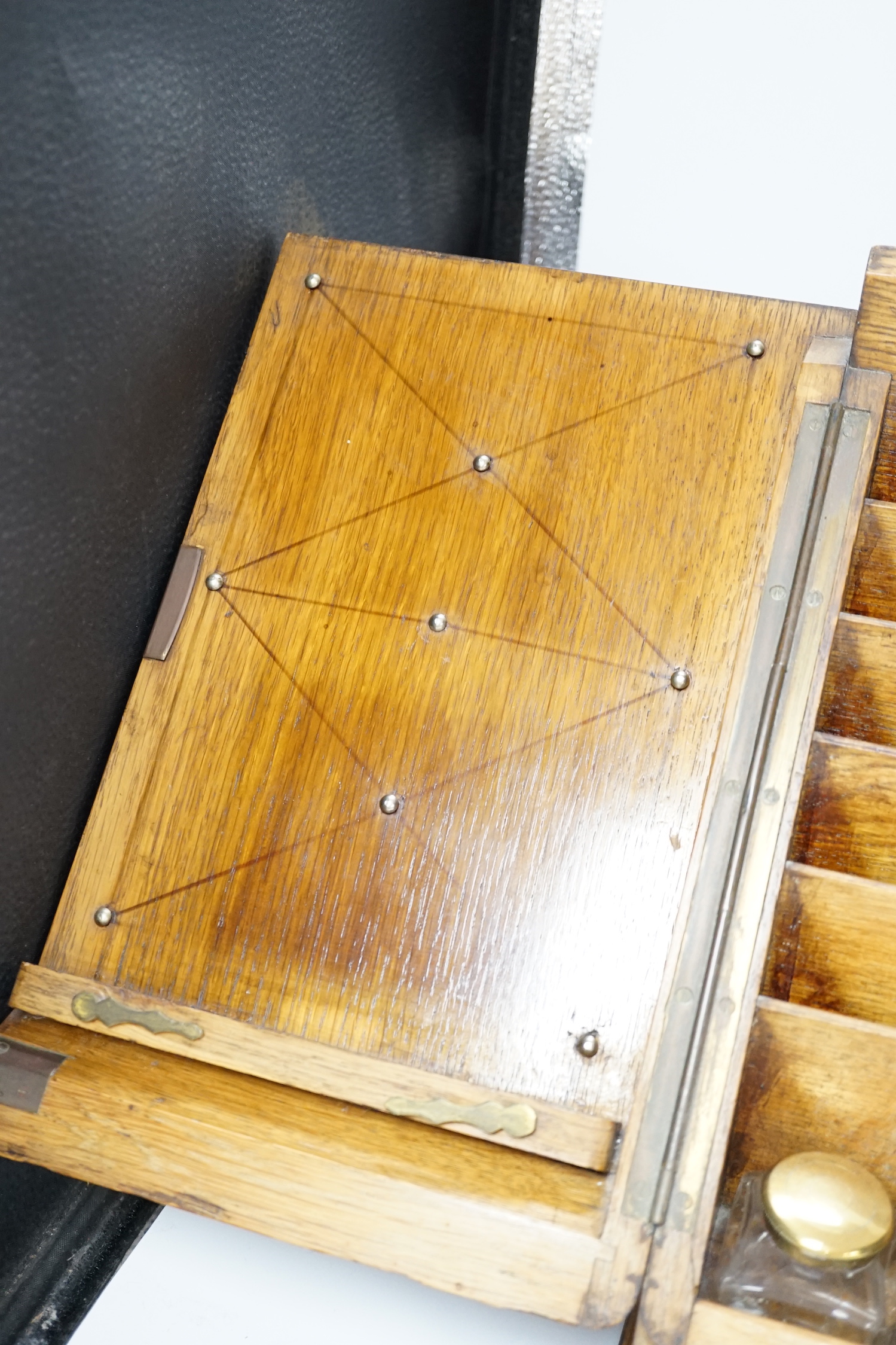 An Edwardian oak stationery casket, 31cm high, 38cm wide, 21.5cm deep